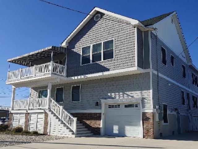 2312 NEW YORK AVENUE - NORTH WILDWOOD SINGLE FAMILY SUMMER VACATION RENTALS at WILDWOODRENTS.COM managed by ISLAND REALTY GROUP - 3 bedroom, 2 bath vacation home located in North Wildwood. Home offers a full kitchen with range, fridge, dishwasher, microwave, toaster, Keurig, disposal, and air fryer. Amenities include central a/c, washer/dryer, 4 car off street parking, wifi, balcony, outside shower. TV is streaming only, no live cable provided. Sleeps 10:  1 King, 1Double, 2 Singles, 1 Queen Sleep Sofa, 1 Air Mattress. First floor has 2 bedrooms and Jack & Jill bath! Second floor has great room with cathedral ceiling, half bath, and master bedroom/ bath. Large floor plan provides space for all to enjoy! North Wildwood Rentals, Wildwood Rentals, Wildwood Crest Rentals and Diamond Beach Rentals in all price ranges for weekly, monthly, seasonal and weekend vacation rentals plus Wildwood real estate sales of homes, condos, vacation and investment properties in and around Wildwood New Jersey. We offer over 400 properties plus exclusive vacation homes so you can book the shore rental of your choice online and guarantee your vacation at the Shore. Rent with confidence at Island Realty Group! Visit www.wildwoodrents.com to book online or call our office at 609.522.4999. Our office at 1701 New Jersey Avenue in North Wildwood is open 7 days a week!