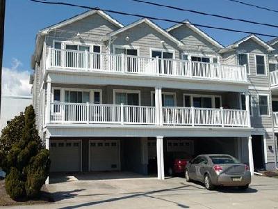2506 SURF AVENUE  UNIT 100  NORTH WILDWOOD SUMMER VACATION RENTALS WITH POOLS  Location, Pool and New Owner this Season will all add up to a great family vacation full of memories. Tastefully decorated in a Coastal them this 3 bedroom 2 bath condominium is conveniently located 50ft from Beachblock in North Wildwood. Larger  than your typical condo with well-proportioned bedrooms and an fully-appointed kitchen overlooking the expansive living room, youll first notice the upgrades throughout this fine home. Granite counters and vanities, tumbled Travertine backsplashes, glistening floors and a full-width deck perfect for people watching. Each bedroom is uniquely decorated with the Master Bedrooms offering a private bath with double basins and a large walk-in closet. Both baths are outfitted with tubs and sliding doors. Additional amenities include Central HVAC, off-street parking for 2 (1 in Private garage and 1 in Driveway) private in-home laundry with full-sized washer and dryer, Hi-Speed Internet, outside shower and dont forget the inviting pool. All of this is located within steps to the World-Famous Wildwood Boardwalk, Beach, Moreys Piers and Sams Pizza! Sleeps 9; Guest Bedroom 1: Queen, Guest Bedroom 2: Bunk with 1 Full and 1 Single, Master Bedroom: 1 Queen, 1 Queen Sofa Bed in Living Room. North Wildwood Rentals, Wildwood Rentals, Wildwood Crest Rentals and Diamond Beach Rentals in all price ranges for weekly, monthly, seasonal and weekend vacation rentals plus Wildwood real estate sales of homes, condos, vacation and investment properties in and around Wildwood New Jersey. We offer over 400 properties plus exclusive vacation homes so you can book the shore rental of your choice online and guarantee your vacation at the Shore. Rent with confidence at Island Realty Group! Visit www.wildwoodrents.com to book online or call our office at 609.522.4999. Our office at 1701 New Jersey Avenue in North Wildwood is open 7 days a week!