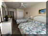 108 EAST 1ST AVENUE - North Wildwood Summer Rental - ENJOY YOUR VACATION WITH YOUR EXTENDED FAMILY in this incredible four bed/two bath first floor condo which very comfortably sleeps 10. Located on East First Avenue with only TWO SHORT BLOCKS TO THE BEACH. Various restaurants, pubs, shopping, miniature golf and water activities within close walking distance. Walk or take the bike trail to Wildwood s Boardwalk. Perfect for entertaining. Excellent accommodations in oversized bedrooms (1-King, 1-Queen, 4-Full/Double Beds). Features upgrades throughout including: flat screen televisions with cable service in all rooms, granite counters in kitchen, tile floors in kitchen and bathrooms, fireplace, beautiful furnishings with tropical decor, spacious rooms, oversized deck, full size washer and dryer, dishwasher, stove with oven, microwave oven, outside shower, parking for 3 cars(2-garage,1-driveway). BRING YOUR PERSONAL LAPTOP AND STAY CONNECTED WITH FREE WIRELESS INTERNET ACCESS. 