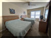 108 EAST 1ST AVENUE - North Wildwood Summer Rental - ENJOY YOUR VACATION WITH YOUR EXTENDED FAMILY in this incredible four bed/two bath first floor condo which very comfortably sleeps 10. Located on East First Avenue with only TWO SHORT BLOCKS TO THE BEACH. Various restaurants, pubs, shopping, miniature golf and water activities within close walking distance. Walk or take the bike trail to Wildwood s Boardwalk. Perfect for entertaining. Excellent accommodations in oversized bedrooms (1-King, 1-Queen, 4-Full/Double Beds). Features upgrades throughout including: flat screen televisions with cable service in all rooms, granite counters in kitchen, tile floors in kitchen and bathrooms, fireplace, beautiful furnishings with tropical decor, spacious rooms, oversized deck, full size washer and dryer, dishwasher, stove with oven, microwave oven, outside shower, parking for 3 cars(2-garage,1-driveway). BRING YOUR PERSONAL LAPTOP AND STAY CONNECTED WITH FREE WIRELESS INTERNET ACCESS. 