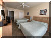 108 EAST 1ST AVENUE - North Wildwood Summer Rental - ENJOY YOUR VACATION WITH YOUR EXTENDED FAMILY in this incredible four bed/two bath first floor condo which very comfortably sleeps 10. Located on East First Avenue with only TWO SHORT BLOCKS TO THE BEACH. Various restaurants, pubs, shopping, miniature golf and water activities within close walking distance. Walk or take the bike trail to Wildwood s Boardwalk. Perfect for entertaining. Excellent accommodations in oversized bedrooms (1-King, 1-Queen, 4-Full/Double Beds). Features upgrades throughout including: flat screen televisions with cable service in all rooms, granite counters in kitchen, tile floors in kitchen and bathrooms, fireplace, beautiful furnishings with tropical decor, spacious rooms, oversized deck, full size washer and dryer, dishwasher, stove with oven, microwave oven, outside shower, parking for 3 cars(2-garage,1-driveway). BRING YOUR PERSONAL LAPTOP AND STAY CONNECTED WITH FREE WIRELESS INTERNET ACCESS. 