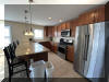 108 EAST 1ST AVENUE - North Wildwood Summer Rental - ENJOY YOUR VACATION WITH YOUR EXTENDED FAMILY in this incredible four bed/two bath first floor condo which very comfortably sleeps 10. Located on East First Avenue with only TWO SHORT BLOCKS TO THE BEACH. Various restaurants, pubs, shopping, miniature golf and water activities within close walking distance. Walk or take the bike trail to Wildwood s Boardwalk. Perfect for entertaining. Excellent accommodations in oversized bedrooms (1-King, 1-Queen, 4-Full/Double Beds). Features upgrades throughout including: flat screen televisions with cable service in all rooms, granite counters in kitchen, tile floors in kitchen and bathrooms, fireplace, beautiful furnishings with tropical decor, spacious rooms, oversized deck, full size washer and dryer, dishwasher, stove with oven, microwave oven, outside shower, parking for 3 cars(2-garage,1-driveway). BRING YOUR PERSONAL LAPTOP AND STAY CONNECTED WITH FREE WIRELESS INTERNET ACCESS. 
