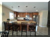 108 EAST 1ST AVENUE - North Wildwood Summer Rental - ENJOY YOUR VACATION WITH YOUR EXTENDED FAMILY in this incredible four bed/two bath first floor condo which very comfortably sleeps 10. Located on East First Avenue with only TWO SHORT BLOCKS TO THE BEACH. Various restaurants, pubs, shopping, miniature golf and water activities within close walking distance. Walk or take the bike trail to Wildwood s Boardwalk. Perfect for entertaining. Excellent accommodations in oversized bedrooms (1-King, 1-Queen, 4-Full/Double Beds). Features upgrades throughout including: flat screen televisions with cable service in all rooms, granite counters in kitchen, tile floors in kitchen and bathrooms, fireplace, beautiful furnishings with tropical decor, spacious rooms, oversized deck, full size washer and dryer, dishwasher, stove with oven, microwave oven, outside shower, parking for 3 cars(2-garage,1-driveway). BRING YOUR PERSONAL LAPTOP AND STAY CONNECTED WITH FREE WIRELESS INTERNET ACCESS. 