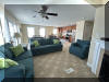 108 EAST 1ST AVENUE - North Wildwood Summer Rental - ENJOY YOUR VACATION WITH YOUR EXTENDED FAMILY in this incredible four bed/two bath first floor condo which very comfortably sleeps 10. Located on East First Avenue with only TWO SHORT BLOCKS TO THE BEACH. Various restaurants, pubs, shopping, miniature golf and water activities within close walking distance. Walk or take the bike trail to Wildwood s Boardwalk. Perfect for entertaining. Excellent accommodations in oversized bedrooms (1-King, 1-Queen, 4-Full/Double Beds). Features upgrades throughout including: flat screen televisions with cable service in all rooms, granite counters in kitchen, tile floors in kitchen and bathrooms, fireplace, beautiful furnishings with tropical decor, spacious rooms, oversized deck, full size washer and dryer, dishwasher, stove with oven, microwave oven, outside shower, parking for 3 cars(2-garage,1-driveway). BRING YOUR PERSONAL LAPTOP AND STAY CONNECTED WITH FREE WIRELESS INTERNET ACCESS. 