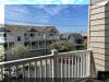 115 EAST HAND AVENUE #203 - WILDWOOD SUMMER VACATION RENTALS at WILDWOODRENTS.COM - Three bedroom + Loft bedroom/two bath vacation home that sleeps 14! Home offers a full kitchen with range, fridge, dishwasher, disposal, microwave, blender, and coffeemaker. Spacious open floor plan. Condo is approximately 2 blocks to Beach, Boardwalk, Shops, Fox Park & Convention Center. 1 block to area restaurants/bars (Mudhen Brewery, Dogtooth, Poppies, Marvis Diner to name a few). Private balcony, full size Washer/Dryer, Central a/c, wifi, 2 car garage parking Main floor features King w/ bath, 2 additional bedrooms with Queens. Loft is perfect for extra company or kids with 4 Queen beds and you still have plenty of space. Dinner table seats 10 and you have 4 additional seats at the island in the kitchen, 65 TV, Sleeps 14 in beds. Beautiful gas fireplace for the cooler seasonal usage. Wildwood Rentals, North Wildwood Rentals, Wildwood Crest Rentals and Diamond Beach Rentals in all price ranges for weekly, monthly, seasonal and weekend vacation rentals plus Wildwood real estate sales of homes, condos, vacation and investment properties in and around Wildwood New Jersey. We offer over 400 properties plus exclusive vacation homes so you can book the shore rental of your choice online and guarantee your vacation at the Shore. Rent with confidence at Island Realty Group! Visit www.wildwoodrents.com to book online or call our office at 609.522.4999. Our office at 1701 New Jersey Avenue in North Wildwood is open 7 days a week!