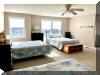 115 EAST HAND AVENUE #203 - WILDWOOD SUMMER VACATION RENTALS at WILDWOODRENTS.COM - Three bedroom + Loft bedroom/two bath vacation home that sleeps 14! Home offers a full kitchen with range, fridge, dishwasher, disposal, microwave, blender, and coffeemaker. Spacious open floor plan. Condo is approximately 2 blocks to Beach, Boardwalk, Shops, Fox Park & Convention Center. 1 block to area restaurants/bars (Mudhen Brewery, Dogtooth, Poppies, Marvis Diner to name a few). Private balcony, full size Washer/Dryer, Central a/c, wifi, 2 car garage parking Main floor features King w/ bath, 2 additional bedrooms with Queens. Loft is perfect for extra company or kids with 4 Queen beds and you still have plenty of space. Dinner table seats 10 and you have 4 additional seats at the island in the kitchen, 65 TV, Sleeps 14 in beds. Beautiful gas fireplace for the cooler seasonal usage. Wildwood Rentals, North Wildwood Rentals, Wildwood Crest Rentals and Diamond Beach Rentals in all price ranges for weekly, monthly, seasonal and weekend vacation rentals plus Wildwood real estate sales of homes, condos, vacation and investment properties in and around Wildwood New Jersey. We offer over 400 properties plus exclusive vacation homes so you can book the shore rental of your choice online and guarantee your vacation at the Shore. Rent with confidence at Island Realty Group! Visit www.wildwoodrents.com to book online or call our office at 609.522.4999. Our office at 1701 New Jersey Avenue in North Wildwood is open 7 days a week!