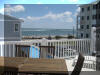 129 WEST SPRUCE AVENUE – INLET CONDOS #2 - NORTH WILDWOOD SUMMER VACATION RENTALS with POOLS at WILDWOODRENTS.COM - Three bedroom, two bath vacation home with view of the inlet! Home offers a full kitchen with range, fridge, dishwasher,  disposal, microwave, coffeemaker and blender. Amenities include central a/c, wifi, pool, balcony, outside shower, storage area, 2 car garage, 1 car driveway. Sleeps 6: 1 Queen, 4 Twins. (full air mattress avail). North Wildwood Rentals, Wildwood Rentals, Wildwood Crest Rentals and Diamond Beach Rentals in all price ranges for weekly, monthly, seasonal and weekend vacation rentals plus Wildwood real estate sales of homes, condos, vacation and investment properties in and around Wildwood New Jersey. We offer over 400 properties plus exclusive vacation homes so you can book the shore rental of your choice online and guarantee your vacation at the Shore. Rent with confidence at Island Realty Group! Visit www.wildwoodrents.com to book online or call our office at 609.522.4999. Our office at 1701 New Jersey Avenue in North Wildwood is open 7 days a week!
