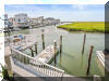 1411 HOFFMAN CANAL - NORTH WILDWOOD BAYFRONT SUMMER VACATION RENTALS at WILDWOODRENTS.COM managed by ISLAND REALTY GROUP, NORTH WILDWOOD REALTORS AND VACATION RENTAL MANAGEMENT - Two story, bayfront home with 4 bedrooms/3 baths! Home offers a full kitchen with range, fridge, dishwasher, disposal, microwave, coffee maker, Keurig and blender. Amenities include central a/c, wifi, multiple bay front balconies/decks, outside shower, gas bbq, boat slip, 3 car off street parking. ***currently being remodeled/updated photos to follow.  Sleeps 18. Master: king, 2nd:queen. North Wildwood Rentals, Wildwood Rentals, Wildwood Crest Rentals and Diamond Beach Rentals in all price ranges for weekly, monthly, seasonal and weekend vacation rentals plus Wildwood real estate sales of homes, condos, vacation and investment properties in and around Wildwood New Jersey. We offer over 400 properties plus exclusive vacation homes so you can book the shore rental of your choice online and guarantee your vacation at the Shore. Rent with confidence at Island Realty Group! Visit www.wildwoodrents.com to book online or call our office at 609.522.4999. Our office at 1701 New Jersey Avenue in North Wildwood is open 7 days a week!