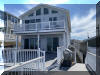1411 HOFFMAN CANAL - NORTH WILDWOOD BAYFRONT SUMMER VACATION RENTALS at WILDWOODRENTS.COM managed by ISLAND REALTY GROUP, NORTH WILDWOOD REALTORS AND VACATION RENTAL MANAGEMENT - 2 story, bayfront home with 4 bedrooms and 3 baths! Home offers a full kitchen with range, fridge, dishwasher, disposal, microwave, coffee maker, Keurig and blender. Amenities include central a/c, wifi, multiple bay front balconies/decks, outside shower, gas bbq, boat slip, 3 car off street parking. Sleeps 14. Master: king, 2nd:queen. North Wildwood Rentals, Wildwood Rentals, Wildwood Crest Rentals and Diamond Beach Rentals in all price ranges for weekly, monthly, seasonal and weekend vacation rentals plus Wildwood real estate sales of homes, condos, vacation and investment properties in and around Wildwood New Jersey. We offer over 400 properties plus exclusive vacation homes so you can book the shore rental of your choice online and guarantee your vacation at the Shore. Rent with confidence at Island Realty Group! Visit www.wildwoodrents.com to book online or call our office at 609.522.4999. Our office at 1701 New Jersey Avenue in North Wildwood is open 7 days a week!