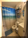 1605 OCEAN AVENUE  BRIGADOON CONDOS #212 - NORTH WILDWOOD BEACHBLOCK SUMMER VACATION RENTALS with POOLS at WILDWOODRENTS.COM managed by ISLAND REALTY GROUP, NORTH WILDWOOD REALTORS AND VACATION RENTAL MANAGEMENT - Welcome to your perfect beachside getaway in North Wildwood! This charming property is ideal for a family of up to 6 guests, offering 2 bedrooms and 1 full bathroom for your comfort and convenience. As you step inside, you'll find a cozy and well-appointed living space with all the amenities you need for a relaxing stay. The kitchen is fully equipped with a dishwasher, microwave, coffee maker, toaster, stove, and full-size refrigerator, making meal preparation a breeze. Enjoy your meals at the dining table or head out to the deck to dine al fresco with deck furniture and a gas BBQ grill. After a day at the beach, unwind in the comfortable living room with a sofa bed, smart TV, and high-speed internet access. The property features central AC and ceiling fans to keep you cool during the warmer months. For your convenience, there is a washer, dryer, and shared washer/dryer available on-site. When it's time to rest, the bedrooms offer a variety of sleeping arrangements including a double bed, twin/twin bunk with twin trundle bed. Linens are not provided, so be sure to bring your own. During your stay, take advantage of the outdoor pool, and outside shower shared with other guests. Parking is available for one vehicle. Located in North Wildwood Beach Side, this property is just a short walk away from the sandy shores and sparkling waters of the beach. Explore the local attractions, restaurants, and shops or simply relax and soak up the sun. Please note that this property does not allow pets and is smoke-free. Come and experience the best of beachside living at this North Wildwood retreat. Book your stay today! North Wildwood Rentals, Wildwood Rentals, Wildwood Crest Rentals and Diamond Beach Rentals in all price ranges for weekly, monthly, seasonal and weekend vacation rentals plus Wildwood real estate sales of homes, condos, vacation and investment properties in and around Wildwood New Jersey. We offer over 400 properties plus exclusive vacation homes so you can book the shore rental of your choice online and guarantee your vacation at the Shore. Rent with confidence at Island Realty Group! Visit www.wildwoodrents.com to book online or call our office at 609.522.4999. Our office at 1701 New Jersey Avenue in North Wildwood is open 7 days a week!