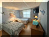 1800 ATLANTIC AVENUE  HAMILTON HOUSE #204 - NORTH WILDWOOD SUMMER VACATION RENTALS with POOLS at WILDWOODRENTS.COM managed by ISLAND REALTY GROUP - This home features 2 bedrooms and 1 full bathroom, comfortably accommodating up to 6 guests. The sleeping arrangements include a queen bed in one bedroom, two single beds in the second bedroom, and a double sofa bed in the living room. The property is equipped with all the amenities you need for a relaxing stay. The kitchen is fully stocked with a microwave, coffee maker, toaster, blender, oven, Keurig coffee maker, and mixer, making meal preparation a breeze. A shared washer and dryer (coin-operated) are available for your convenience, along with a vacuum cleaner for easy clean-up. Entertainment options abound with cable TV and 3 smart TVs throughout the property, ensuring you never miss your favorite shows or movies. Stay connected with wireless internet access, perfect for remote work or streaming your favorite content. Step outside to enjoy the fresh sea breeze on the deck or patio, complete with comfortable deck furniture for lounging in the sun. Take a refreshing dip in the community pool, perfect for cooling off on hot summer days.  1 car off street parking.  North Wildwood Rentals, Wildwood Rentals, Wildwood Crest Rentals and Diamond Beach Rentals in all price ranges for weekly, monthly, seasonal and weekend vacation rentals plus Wildwood real estate sales of homes, condos, vacation and investment properties in and around Wildwood New Jersey. We offer over 400 properties plus exclusive vacation homes so you can book the shore rental of your choice online and guarantee your vacation at the Shore. Rent with confidence at Island Realty Group! Visit www.wildwoodrents.com to book online or call our office at 609.522.4999. Our office at 1701 New Jersey Avenue in North Wildwood is open 7 days a week!