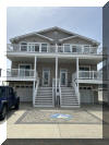 218 WEST 19TH AVENUE - NORTH WILDWOOD SEASONAL SUMMER VACATION RENTALS at WILDWOODRENTS.COM managed by ISLAND REALTY GROUP - This property is perfect for families , with 4 bedrooms and 3.5 bathrooms that can comfortably sleep up to 8 guests. As you step inside, you'll find a bedroom, with full bath. Two additional bedrooms with a shared bath are on the first floor. The 2nd floor you'll find a spacious and living space with all the amenities you could ask for. The kitchen is fully equipped with a dishwasher, microwave, disposal, coffee maker, toaster oven, blender, and more. The central AC and ceiling fans will keep you cool and comfortable throughout your stay. Each bedroom is thoughtfully designed there is 1 Queen bedroom, (2) twin & twin bedrooms, and a bedroom with a twin/twin bunk, providing plenty of sleeping options for everyone. The property also features a garage and 3 parking spaces for your convenience. Relax and unwind on one of the 4 decks, complete with deck furniture and beach equipment for your enjoyment. High-speed internet, smart TVs, and wireless LAN are available for your entertainment needs. For your convenience, linens, blankets, pillows, and beach essentials are provided. You'll also find a Keurig coffee maker, pots and pans, silverware, dinnerware, and cooking utensils in the fully equipped kitchen. This property is smoke-free and does not allow pets, ensuring a clean and comfortable environment for all guests. With 5 bicycles at your disposal, you can easily explore the beautiful surroundings of North Wildwood. Don't miss out on this fantastic vacation rental with all the comforts of home and more. Book your stay now and create unforgettable memories in North Wildwood Bay Side! North Wildwood Rentals, Wildwood Rentals, Wildwood Crest Rentals and Diamond Beach Rentals in all price ranges for weekly, monthly, seasonal and weekend vacation rentals plus Wildwood real estate sales of homes, condos, vacation and investment properties in and around Wildwood New Jersey. We offer over 400 properties plus exclusive vacation homes so you can book the shore rental of your choice online and guarantee your vacation at the Shore. Rent with confidence at Island Realty Group! Visit www.wildwoodrents.com to book online or call our office at 609.522.4999. Our office at 1701 New Jersey Avenue in North Wildwood is open 7 days a week!