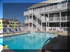2207 SURF AVENUE � BAYBERRY CONDOS #101 - NORTH WILDWOOD BEACHBLOCK SUMMER VACATION RENTALS with POOLS at WILDWOODRENTS.COM managed by ISLAND REALTY GROUP Welcome to your perfect beachside getaway in North Wildwood! This charming property is ideal for a family of up to 6 guests, offering 2 bedrooms and 1 full bathroom for your comfort and convenience. As you step inside, you'll find a cozy living space with modern furnishings and a welcoming atmosphere. The living room features a comfortable sofa bed that can accommodate 2 guests, along with a Smart TV for your entertainment needs. The fully equipped kitchen, complete with a dishwasher, microwave, Keurig coffee maker, toaster, blender, stove, oven, and full-size refrigerator. Whip up delicious meals and snacks to enjoy at the dining table or out on the deck with deck furniture and a shared BBQ gas grill. When it's time to rest, retreat to one of the two bedrooms, each offering queen beds with pillows and blankets for a restful night's sleep. With high-speed internet and wireless LAN available, you can stay connected throughout your stay. Pool, outside shower, beach block! During your visit, take advantage of the property's amenities, including central A/C, ceiling fans, shared washer/dryer, parking for one vehicle, and access to the outdoor pool and association pool. After a day at the beach, rinse off in the shared outside shower before relaxing on the balcony or open/covered porch. Please note that this property does not allow pets and linens are not provided, so be sure to bring your own. Cleaning is included in the rate for your convenience. Don't miss out on this fantastic opportunity to experience the best of North Wildwood! Book your stay today and make unforgettable memories at this beachside retreat. North Wildwood Rentals, Wildwood Rentals, Wildwood Crest Rentals and Diamond Beach Rentals in all price ranges for weekly, monthly, seasonal and weekend vacation rentals plus Wildwood real estate sales of homes, condos, vacation and investment properties in and around Wildwood New Jersey. We offer over 400 properties plus exclusive vacation homes so you can book the shore rental of your choice online and guarantee your vacation at the Shore. Rent with confidence at Island Realty Group! Visit www.wildwoodrents.com to book online or call our office at 609.522.4999. Our office at 1701 New Jersey Avenue in North Wildwood is open 7 days a week! 
