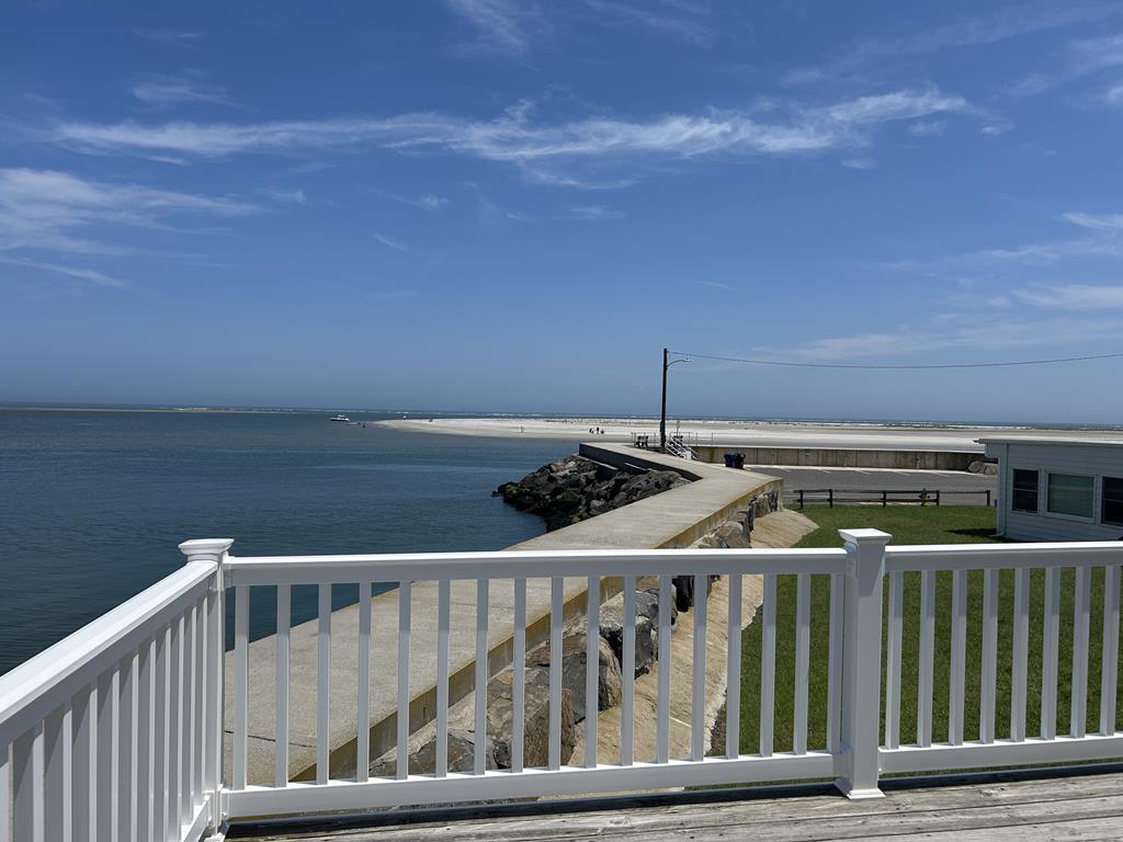 221 HOFFMAN AVENUE - NORTH WILDWOOD SUMMER WATERFRONT VACATION RENTALS at WILDWOODRENTS.COM managed by ISLAND REALTY GROUP - Welcome to your perfect inlet front getaway in North Wildwood! This charming traditional Wildwood property is ideal for a family of up to 7 guests, offering 3 cozy bedrooms and 2 full bathrooms for your comfort and convenience. As you step inside, you'll find a well-appointed living space with all the amenities you need for a relaxing stay. The fully equipped kitchen features a dishwasher, microwave, coffee maker, toaster oven, stove, and a full-size refrigerator, making meal preparation a breeze. The dining area is perfect for enjoying meals together, and the comfortable living room is ideal for unwinding after a day at the beach. The sleeping arrangements include 2 queen beds, full/twin bunk and twin/twin bunk, ensuring that everyone has a comfortable place to rest. Central AC and ceiling fans keep the interior cool on hot days, while the washer and dryer make it easy to keep your beachwear fresh throughout your stay. Outside, you'll find a wrap around deck with deck furniture where you can soak up the sun or enjoy al fresco dining. STUNNING VIEWS FROM EVERY ANGLE! The property also features a balcony, lawn area, and parking for your convenience. Please note that this rental does not allow pets and guests are required to bring their own linens. Located in the heart of North Wildwood Beach Side, this property is just a short walk away from the sandy shores and sparkling waters of the beach. Explore the local attractions, restaurants, and shops, or simply relax and unwind in your own private oasis. Don't miss out on the opportunity to experience the best of North Wildwood from this fantastic rental property. Book your stay today and create unforgettable memories with your loved ones! North Wildwood Rentals, Wildwood Rentals, Wildwood Crest Rentals and Diamond Beach Rentals in all price ranges for weekly, monthly, seasonal and weekend vacation rentals plus Wildwood real estate sales of homes, condos, vacation and investment properties in and around Wildwood New Jersey. We offer over 400 properties plus exclusive vacation homes so you can book the shore rental of your choice online and guarantee your vacation at the Shore. Rent with confidence at Island Realty Group! Visit www.wildwoodrents.com to book online or call our office at 609.522.4999. Our office at 1701 New Jersey Avenue in North Wildwood is open 7 days a week!