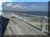 221 HOFFMAN AVENUE - NORTH WILDWOOD SUMMER WATERFRONT VACATION RENTALS at WILDWOODRENTS.COM managed by ISLAND REALTY GROUP - Welcome to your perfect inlet front getaway in North Wildwood! This charming traditional Wildwood property is ideal for a family of up to 7 guests, offering 3 cozy bedrooms and 2 full bathrooms for your comfort and convenience. As you step inside, you'll find a well-appointed living space with all the amenities you need for a relaxing stay. The fully equipped kitchen features a dishwasher, microwave, coffee maker, toaster oven, stove, and a full-size refrigerator, making meal preparation a breeze. The dining area is perfect for enjoying meals together, and the comfortable living room is ideal for unwinding after a day at the beach. The sleeping arrangements include 2 queen beds, full/twin bunk and twin/twin bunk, ensuring that everyone has a comfortable place to rest. Central AC and ceiling fans keep the interior cool on hot days, while the washer and dryer make it easy to keep your beachwear fresh throughout your stay. Outside, you'll find a wrap around deck with deck furniture where you can soak up the sun or enjoy al fresco dining. STUNNING VIEWS FROM EVERY ANGLE! The property also features a balcony, lawn area, and parking for your convenience. Please note that this rental does not allow pets and guests are required to bring their own linens. Located in the heart of North Wildwood Beach Side, this property is just a short walk away from the sandy shores and sparkling waters of the beach. Explore the local attractions, restaurants, and shops, or simply relax and unwind in your own private oasis. Don't miss out on the opportunity to experience the best of North Wildwood from this fantastic rental property. Book your stay today and create unforgettable memories with your loved ones! North Wildwood Rentals, Wildwood Rentals, Wildwood Crest Rentals and Diamond Beach Rentals in all price ranges for weekly, monthly, seasonal and weekend vacation rentals plus Wildwood real estate sales of homes, condos, vacation and investment properties in and around Wildwood New Jersey. We offer over 400 properties plus exclusive vacation homes so you can book the shore rental of your choice online and guarantee your vacation at the Shore. Rent with confidence at Island Realty Group! Visit www.wildwoodrents.com to book online or call our office at 609.522.4999. Our office at 1701 New Jersey Avenue in North Wildwood is open 7 days a week!
