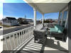 309 WEST WALNUT AVENUE - NORTH WILDWOOD BAYSIDE SUMMER VACATION RENTALS at WILDWOODRENTS.COM managed by ISLAND REALTY GROUP - 4 bedroom, 3 bath vacation home located bayside with water way views and slight ocean view! Large floor plan! Home boasts a family room on the first level with a pool table, large TV, and bar. 2nd floor offers a large fully equipped kitchen, dining, and living room. 2 bedrooms and a 1 bathroom. Third floor has two additional bedrooms and two baths. Three balconies and back yard for outdoor enjoyment! Amenities include central a/c, washer/dryer, wifi, outside shower, and 4 car off street parking. Sleeps 14: king, 3 queen, 2 full/twin bunks, and sleep sofa.  - North Wildwood Rentals, Wildwood Rentals, Wildwood Crest Rentals and Diamond Beach Rentals in all price ranges for weekly, monthly, seasonal and weekend vacation rentals plus Wildwood real estate sales of homes, condos, vacation and investment properties in and around Wildwood New Jersey. We offer over 400 properties plus exclusive vacation homes so you can book the shore rental of your choice online and guarantee your vacation at the Shore. Rent with confidence at Island Realty Group! Visit www.wildwoodrents.com to book online or call our office at 609.522.4999. Our office at 1701 New Jersey Avenue in North Wildwood is open 7 days a week!