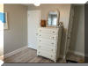 318 EAST HOLLYWOOD AVENUE  UNIT 2 - WILDWOOD CREST SUMMER VACATION RENTALS at WILDWOODRENTS.COM managed by ISLAND REALTY GROUP - Welcome to your perfect beachside getaway in Wildwood Crest! This charming property is ideal for a group of up to 6 guests, offering 2 bedrooms and 1 full bathroom for your comfort and convenience. As you step inside, you'll find a cozy and well-appointed living space with modern amenities to make your stay unforgettable. The living room features a comfortable sofa bed, perfect for relaxing after a day at the beach. Enjoy movie nights with the DVD player and streaming services on the smart TV. The kitchen is fully equipped with everything you need to whip up delicious meals, including a dishwasher, microwave, coffee maker, and toaster. The dining area is perfect for enjoying meals together with your loved ones. Both bedrooms are tastefully decorated and offer a peaceful retreat after a day of sun and sand. The first bedroom features a double bed, while the second bedroom has a twin bed with twin trundle for additional sleeping space. All beds come with mattress pads, pillows, and blankets for your comfort. Step outside to the deck and soak up the sun or enjoy a BBQ with friends and family. Take a refreshing dip in the outdoor pool or rinse off in the shared outdoor shower after a day at the beach. Additional amenities include central AC, ceiling fans, a washer and dryer, iron, ironing board, vacuum cleaner, high-speed internet, and smart TVs in each bedroom. Parking is a breeze with one designated parking space. This property is pet-friendly, so feel free to bring your furry friends along for the vacation. Please note that tenants are required to bring their own linens. Don't miss out on this fantastic opportunity to experience the best of Wildwood Crest! Book your stay today and create lasting memories in this beautiful beachside retreat. Wildwood Crest Rentals, North Wildwood Rentals, Wildwood Rentals and Diamond Beach Rentals in all price ranges for weekly, monthly, seasonal and weekend vacation rentals plus Wildwood real estate sales of homes, condos, vacation and investment properties in and around Wildwood New Jersey. We offer over 400 properties plus exclusive vacation homes so you can book the shore rental of your choice online and guarantee your vacation at the Shore. Rent with confidence at Island Realty Group! Visit www.wildwoodrents.com to book online or call our office at 609.522.4999. Our office at 1701 New Jersey Avenue in North Wildwood is open 7 days a week!