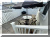 318 EAST HOLLYWOOD AVENUE  UNIT 2 - WILDWOOD CREST SUMMER VACATION RENTALS at WILDWOODRENTS.COM managed by ISLAND REALTY GROUP - Welcome to your perfect beachside getaway in Wildwood Crest! This charming property is ideal for a group of up to 6 guests, offering 2 bedrooms and 1 full bathroom for your comfort and convenience. As you step inside, you'll find a cozy and well-appointed living space with modern amenities to make your stay unforgettable. The living room features a comfortable sofa bed, perfect for relaxing after a day at the beach. Enjoy movie nights with the DVD player and streaming services on the smart TV. The kitchen is fully equipped with everything you need to whip up delicious meals, including a dishwasher, microwave, coffee maker, and toaster. The dining area is perfect for enjoying meals together with your loved ones. Both bedrooms are tastefully decorated and offer a peaceful retreat after a day of sun and sand. The first bedroom features a double bed, while the second bedroom has a twin bed with twin trundle for additional sleeping space. All beds come with mattress pads, pillows, and blankets for your comfort. Step outside to the deck and soak up the sun or enjoy a BBQ with friends and family. Take a refreshing dip in the outdoor pool or rinse off in the shared outdoor shower after a day at the beach. Additional amenities include central AC, ceiling fans, a washer and dryer, iron, ironing board, vacuum cleaner, high-speed internet, and smart TVs in each bedroom. Parking is a breeze with one designated parking space. This property is pet-friendly, so feel free to bring your furry friends along for the vacation. Please note that tenants are required to bring their own linens. Don't miss out on this fantastic opportunity to experience the best of Wildwood Crest! Book your stay today and create lasting memories in this beautiful beachside retreat. Wildwood Crest Rentals, North Wildwood Rentals, Wildwood Rentals and Diamond Beach Rentals in all price ranges for weekly, monthly, seasonal and weekend vacation rentals plus Wildwood real estate sales of homes, condos, vacation and investment properties in and around Wildwood New Jersey. We offer over 400 properties plus exclusive vacation homes so you can book the shore rental of your choice online and guarantee your vacation at the Shore. Rent with confidence at Island Realty Group! Visit www.wildwoodrents.com to book online or call our office at 609.522.4999. Our office at 1701 New Jersey Avenue in North Wildwood is open 7 days a week!