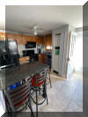 318 EAST HOLLYWOOD AVENUE  UNIT 2 - WILDWOOD CREST SUMMER VACATION RENTALS at WILDWOODRENTS.COM managed by ISLAND REALTY GROUP - Welcome to your perfect beachside getaway in Wildwood Crest! This charming property is ideal for a group of up to 6 guests, offering 2 bedrooms and 1 full bathroom for your comfort and convenience. As you step inside, you'll find a cozy and well-appointed living space with modern amenities to make your stay unforgettable. The living room features a comfortable sofa bed, perfect for relaxing after a day at the beach. Enjoy movie nights with the DVD player and streaming services on the smart TV. The kitchen is fully equipped with everything you need to whip up delicious meals, including a dishwasher, microwave, coffee maker, and toaster. The dining area is perfect for enjoying meals together with your loved ones. Both bedrooms are tastefully decorated and offer a peaceful retreat after a day of sun and sand. The first bedroom features a double bed, while the second bedroom has a twin bed with twin trundle for additional sleeping space. All beds come with mattress pads, pillows, and blankets for your comfort. Step outside to the deck and soak up the sun or enjoy a BBQ with friends and family. Take a refreshing dip in the outdoor pool or rinse off in the shared outdoor shower after a day at the beach. Additional amenities include central AC, ceiling fans, a washer and dryer, iron, ironing board, vacuum cleaner, high-speed internet, and smart TVs in each bedroom. Parking is a breeze with one designated parking space. This property is pet-friendly, so feel free to bring your furry friends along for the vacation. Please note that tenants are required to bring their own linens. Don't miss out on this fantastic opportunity to experience the best of Wildwood Crest! Book your stay today and create lasting memories in this beautiful beachside retreat. Wildwood Crest Rentals, North Wildwood Rentals, Wildwood Rentals and Diamond Beach Rentals in all price ranges for weekly, monthly, seasonal and weekend vacation rentals plus Wildwood real estate sales of homes, condos, vacation and investment properties in and around Wildwood New Jersey. We offer over 400 properties plus exclusive vacation homes so you can book the shore rental of your choice online and guarantee your vacation at the Shore. Rent with confidence at Island Realty Group! Visit www.wildwoodrents.com to book online or call our office at 609.522.4999. Our office at 1701 New Jersey Avenue in North Wildwood is open 7 days a week!