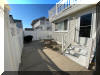 318 EAST HOLLYWOOD AVENUE  UNIT 2 - WILDWOOD CREST SUMMER VACATION RENTALS at WILDWOODRENTS.COM managed by ISLAND REALTY GROUP - Welcome to your perfect beachside getaway in Wildwood Crest! This charming property is ideal for a group of up to 6 guests, offering 2 bedrooms and 1 full bathroom for your comfort and convenience. As you step inside, you'll find a cozy and well-appointed living space with modern amenities to make your stay unforgettable. The living room features a comfortable sofa bed, perfect for relaxing after a day at the beach. Enjoy movie nights with the DVD player and streaming services on the smart TV. The kitchen is fully equipped with everything you need to whip up delicious meals, including a dishwasher, microwave, coffee maker, and toaster. The dining area is perfect for enjoying meals together with your loved ones. Both bedrooms are tastefully decorated and offer a peaceful retreat after a day of sun and sand. The first bedroom features a double bed, while the second bedroom has a twin bed with twin trundle for additional sleeping space. All beds come with mattress pads, pillows, and blankets for your comfort. Step outside to the deck and soak up the sun or enjoy a BBQ with friends and family. Take a refreshing dip in the outdoor pool or rinse off in the shared outdoor shower after a day at the beach. Additional amenities include central AC, ceiling fans, a washer and dryer, iron, ironing board, vacuum cleaner, high-speed internet, and smart TVs in each bedroom. Parking is a breeze with one designated parking space. This property is pet-friendly, so feel free to bring your furry friends along for the vacation. Please note that tenants are required to bring their own linens. Don't miss out on this fantastic opportunity to experience the best of Wildwood Crest! Book your stay today and create lasting memories in this beautiful beachside retreat. Wildwood Crest Rentals, North Wildwood Rentals, Wildwood Rentals and Diamond Beach Rentals in all price ranges for weekly, monthly, seasonal and weekend vacation rentals plus Wildwood real estate sales of homes, condos, vacation and investment properties in and around Wildwood New Jersey. We offer over 400 properties plus exclusive vacation homes so you can book the shore rental of your choice online and guarantee your vacation at the Shore. Rent with confidence at Island Realty Group! Visit www.wildwoodrents.com to book online or call our office at 609.522.4999. Our office at 1701 New Jersey Avenue in North Wildwood is open 7 days a week!