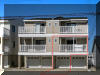 411 EAST 10TH AVENUE  #101 - NORTH WILDWOOD SUMMER VACATION RENTALS at WILDWOODRENTS.COM managed by ISLAND REALTY GROUP - Welcome to your perfect beachside getaway located only 1 block to the Beach in North Wildwood! This charming property is ideal for a family of 4, offering 2 bedrooms and 2 full bathrooms for your comfort and convenience. As you step inside, you'll find a cozy living space with modern amenities to make your stay enjoyable. The fully equipped kitchen features a dishwasher, microwave, disposal, toaster, stove, full-size refrigerator, oven, and all the cooking essentials you need. Whether you're preparing a quick snack or a gourmet meal, this kitchen has you covered. After a day at the beach, unwind in the comfortable bedrooms, including 1 queen bed and 2 single beds. With central AC, ceiling fans, and a smoke-free environment, you'll stay cool and refreshed throughout your stay. The property also includes a washer, dryer, vacuum cleaner, and cleaning services included in the rate for added convenience. Relax on the balcony with a cup of coffee from the Keurig machine, or catch up on your favorite shows on the television with cable TV and high-speed internet. Parking is a breeze with 1 parking space available for your use. Please note that this property does not allow pets and tenants are required to bring their own linens. The property comes fully furnished with blankets, pillows, pots, pans, silverware, dinnerware, and cooking utensils for your comfort. Don't miss out on this fantastic opportunity to enjoy a beachside retreat in North Wildwood. Book your stay today and create unforgettable memories in this beautiful vacation rental! North Wildwood Rentals, Wildwood Rentals, Wildwood Crest Rentals and Diamond Beach Rentals in all price ranges for weekly, monthly, seasonal and weekend vacation rentals plus Wildwood real estate sales of homes, condos, vacation and investment properties in and around Wildwood New Jersey. We offer over 400 properties plus exclusive vacation homes so you can book the shore rental of your choice online and guarantee your vacation at the Shore. Rent with confidence at Island Realty Group! Visit www.wildwoodrents.com to book online or call our office at 609.522.4999. Our office at 1701 New Jersey Avenue in North Wildwood is open 7 days a week!