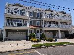 419 EAST 21ST AVENUE #201 - SANS SOUCI CONDOMINIUMS LOCATED BEACHBLOCK IN NORTH WILDWOOD! Beach block with ocean views and pool in North Wildwood. This rental is on a Sunday to Sunday rental schedule. Four bedroom /two bath home has a spacious floor plan with a spiral staircase leading to the 4th bedroom in the loft. Full kitchen has fridge, range, dishwasher, microwave, disposal, coffeemaker and toaster. Amenities include 2 balconies with ocean view, 1 balcony with pool view, pool, central a/c, washer/dryer, wifi, and 2 car off street parking. Sleeps 14; 5 queen, twin/twin bunk, and full futon. North Wildwood Rentals, Wildwood Rentals, Wildwood Crest Rentals and Diamond Beach Rentals in all price ranges for weekly, monthly, seasonal and weekend vacation rentals plus Wildwood real estate sales of homes, condos, vacation and investment properties in and around Wildwood New Jersey. We offer over 400 properties plus exclusive vacation homes so you can book the shore rental of your choice online and guarantee your vacation at the Shore. Rent with confidence at Island Realty Group! Visit www.wildwoodrents.com to book online or call our office at 609.522.4999. Our office at 1701 New Jersey Avenue in North Wildwood is open 7 days a week!
