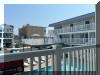 442 EAST 21ST AVENUE � LAMPOST #213 - NORTH WILDWOOD SUMMER VACATION RENTALS with POOLS at WILDWOODRENTS.COM managed by ISLAND REALTY GROUP, NORTH WILDWOOD REALTORS AND VACATION RENTAL MANAGEMENT - Welcome to your cozy beachside retreat in North Wildwood! This charming property is perfect for a family of 4 looking to enjoy a relaxing getaway by the shore. This Studio unit features 1 full bathroom and can comfortably sleep 4 guests. The sleeping arrangements include 1 double bed, 2 single beds(trundle bed), ensuring a restful night's sleep for everyone. Inside, you'll find all the comforts of home, including a well-equipped kitchen with a microwave, coffee maker, toaster oven, stove, and full-size refrigerator. The living area is furnished with a smart TV for entertainment, and high-speed internet is included for your convenience. Step outside onto the deck to soak up the sun or enjoy al fresco dining with deck furniture and a natural gas BBQ grill. The property also offers access to a heated outdoor pool, perfect for a refreshing swim on warm days. Additional amenities include ceiling fans, a washer and dryer (coin-operated), wall AC, parking for 1 vehicle, and an outdoor shower for rinsing off after a day at the beach. The property is smoke-free and does not allow pets. North Wildwood Rentals, Wildwood Rentals, Wildwood Crest Rentals and Diamond Beach Rentals in all price ranges for weekly, monthly, seasonal and weekend vacation rentals plus Wildwood real estate sales of homes, condos, vacation and investment properties in and around Wildwood New Jersey. We offer over 400 properties plus exclusive vacation homes so you can book the shore rental of your choice online and guarantee your vacation at the Shore. Rent with confidence at Island Realty Group! Visit www.wildwoodrents.com to book online or call our office at 609.522.4999. Our office at 1701 New Jersey Avenue in North Wildwood is open 7 days a week!