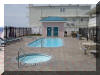 520 EAST STOCKTON ROAD  STOCKTON BEACH HOUSE #105 - WILDWOOD CREST BEACHFRONT SUMMER VACATION RENTALS with POOLS at WILDWOODRENTS.COM managed by ISLAND REALTY GROUP - Welcome to your dream vacation rental in Wildwood Crest! This spacious property can comfortably accommodate up to 10 guests, making it perfect for large families looking for a beach getaway. With 4 bedrooms and 3 full bathrooms, this property offers plenty of space for everyone to relax and unwind. The sleeping arrangements include 1 King Bed, 2 Queen Beds, Full/twin bunk w/twin trundle ensuring a comfortable night's sleep for all. The amenities in this rental are sure to impress, with a fully equipped kitchen featuring a dishwasher, microwave, coffee maker, toaster, and toaster oven. Other conveniences include central AC, a washer and dryer, iron, ironing board, and vacuum cleaner. Entertainment options abound with 3 TVs, cable TV, and high-speed internet. Outside, guests can enjoy the outdoor pool, deck with deck furniture, BBQ gas grill, community hot tub, balcony, and shared beach equipment. The property also offers an elevator for easy access, parking for 2 vehicles, and beach chairs and umbrellas for a day by the ocean. This rental is furnished with all the comforts of home, including blankets, pillows, pots and pans, silverware, dinnerware, cooking utensils, and more. Additional amenities include a Crockpot, Keurig coffee maker, smart TVs with streaming services, and an outside shower shared with other guests. Please note that this property does not allow pets and guests are required to bring their own linens. The property is smoke-free and offers a storage area for your convenience. Guests can also enjoy access to the association pool and other common areas. Don't miss out on the opportunity to stay in this fantastic vacation rental in Wildwood Crest Beach Side. Book now for an unforgettable beach vacation experience! Wildwood Crest Rentals, North Wildwood Rentals, Wildwood Rentals and Diamond Beach Rentals in all price ranges for weekly, monthly, seasonal and weekend vacation rentals plus Wildwood real estate sales of homes, condos, vacation and investment properties in and around Wildwood New Jersey. We offer over 400 properties plus exclusive vacation homes so you can book the shore rental of your choice online and guarantee your vacation at the Shore. Rent with confidence at Island Realty Group! Visit www.wildwoodrents.com to book online or call our office at 609.522.4999. Our office at 1701 New Jersey Avenue in North Wildwood is open 7 days a week!