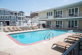 701 OCEAN AVENUE - UNIT 7 - FRIENDSHIP 7 CONDOMINIUM RENTALS IN NORTH WILDWOOD located BEACHBLOCK with a POOL - Come on down and enjoy your summer vacation in this tastefully decorated condominium. Unit 13 is conveniently located on the second floor with a great pool view plus a large sundeck. The Friendship 7 condos are located beachblock and only a short stroll the the world-famous boardwalk. Unit 7 is conveniently located on the first floor with an exceptional view of the pool, a short block from the finest beach at the Jersey shore, a few blocks from the boardwalk and nightlife district of Anglesea. So pack your bags and come on down to enjoy this first floor POOLSIDE unit! Home offers a kitchen with fridge, stovetop, microwave, coffeemaker, toaster and blender. Sleeps 5; full bed, twin bed, and full size sleep sofa. Amenities include pool, deck, wall a/c, outside shower, grill and one car off street parking. Wildwood Rentals, North Wildwood Rentals, Wildwood Crest Rentals and Diamond Beach Rentals in all price ranges for weekly, monthly, seasonal and weekend vacation rentals plus Wildwood real estate sales of homes, condos, vacation and investment properties in and around Wildwood New Jersey. We offer over 400 properties plus exclusive vacation homes so you can book the shore rental of your choice online and guarantee your vacation at the Shore. Rent with confidence at Island Realty Group!